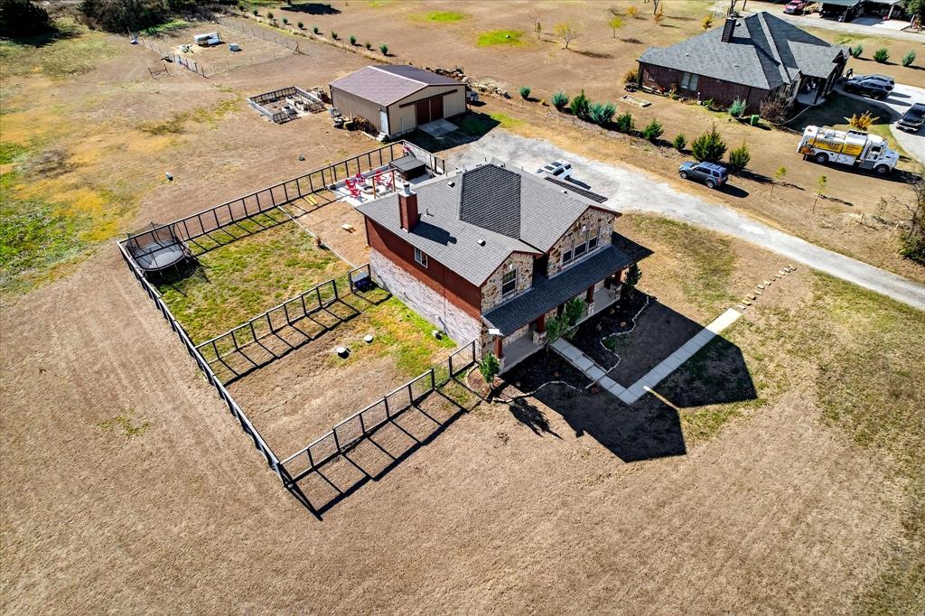 7675 Michael Road Sanger, TX 76266 - Photo 38 of 40 an aerial view of a house with a ocean beach