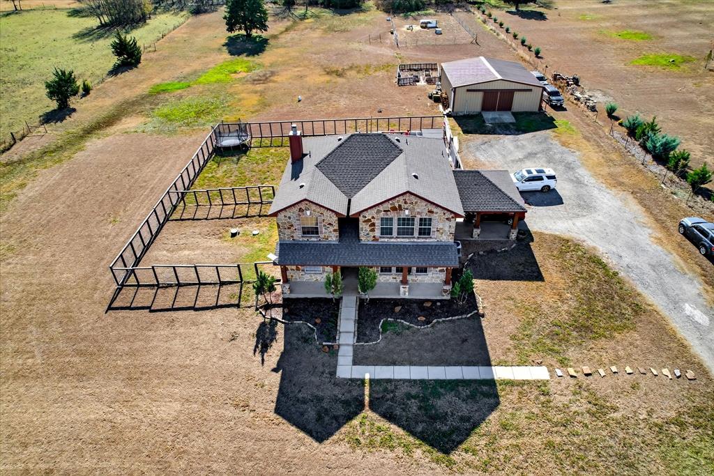 7675 Michael Road Sanger, TX 76266 - Photo 39 of 40 an aerial view of a house with swimming pool