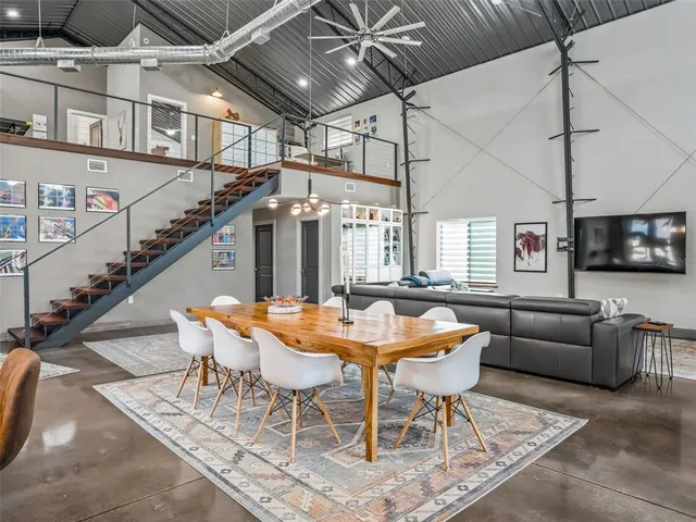 a living room with lots of furniture and a chandelier