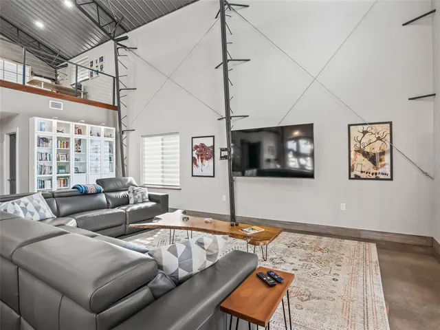 a spacious bedroom with a bed and window