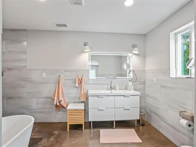 a bed room with furniture and a window