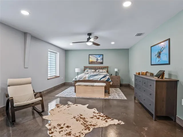 a bathroom with a sink toilet and mirror