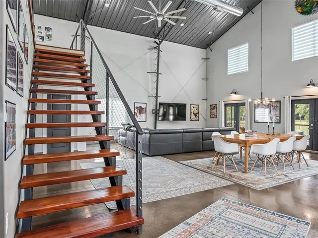 a view of a room with wooden floor