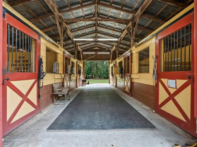 a view of a house with a yard covered with snow in front of house