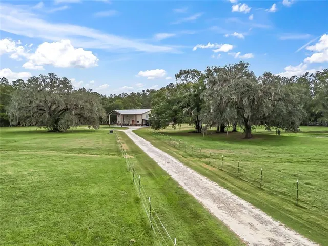 a view of a green field with clear sky