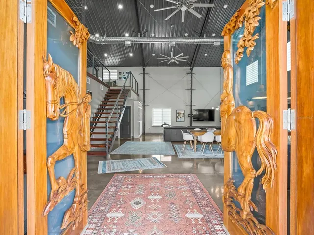 a living room with furniture and a table