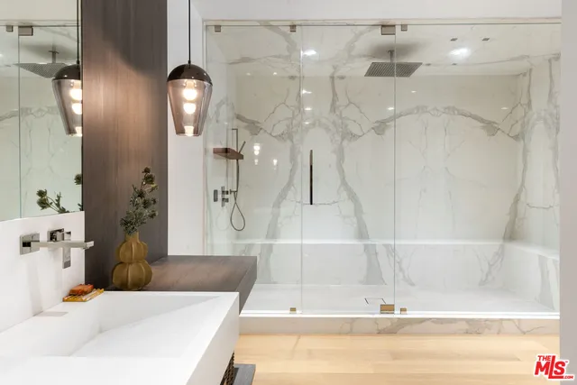 a bathroom with a bathtub and a shower