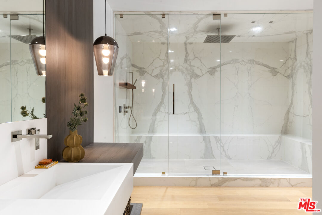 1488 Rising Glen Road Los Angeles, CA 90069 - Photo 29 of 37 a bathroom with a bathtub and a shower