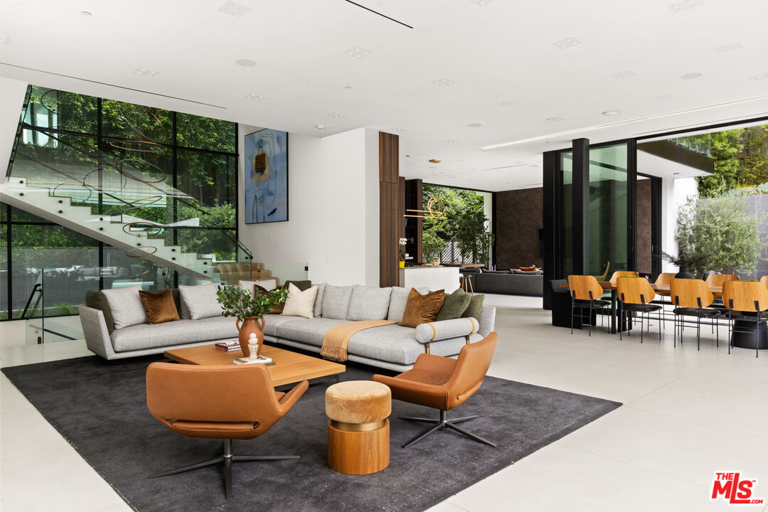 1488 Rising Glen Road Los Angeles, CA 90069 - Photo 6 of 37 a living room with furniture and a large window