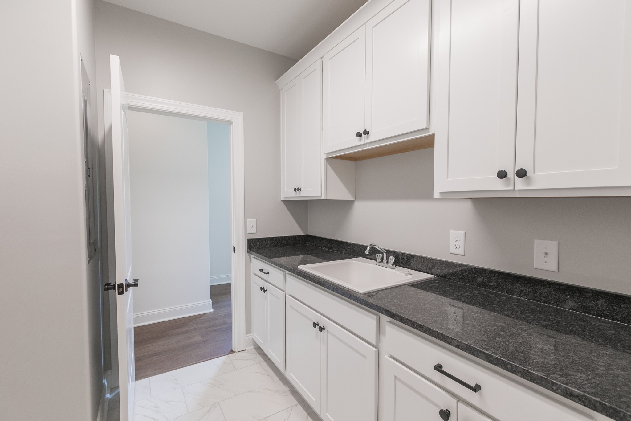 417 Foxrun Run West Springfield, TN 37172 - Photo 11 of 49 a kitchen with granite countertop white cabinets and a sink