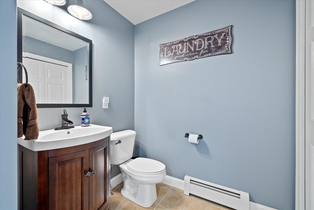 232 Sherbert Road Ashburnham, MA 01430 - Photo 17 of 42 a bathroom with a toilet sink and mirror