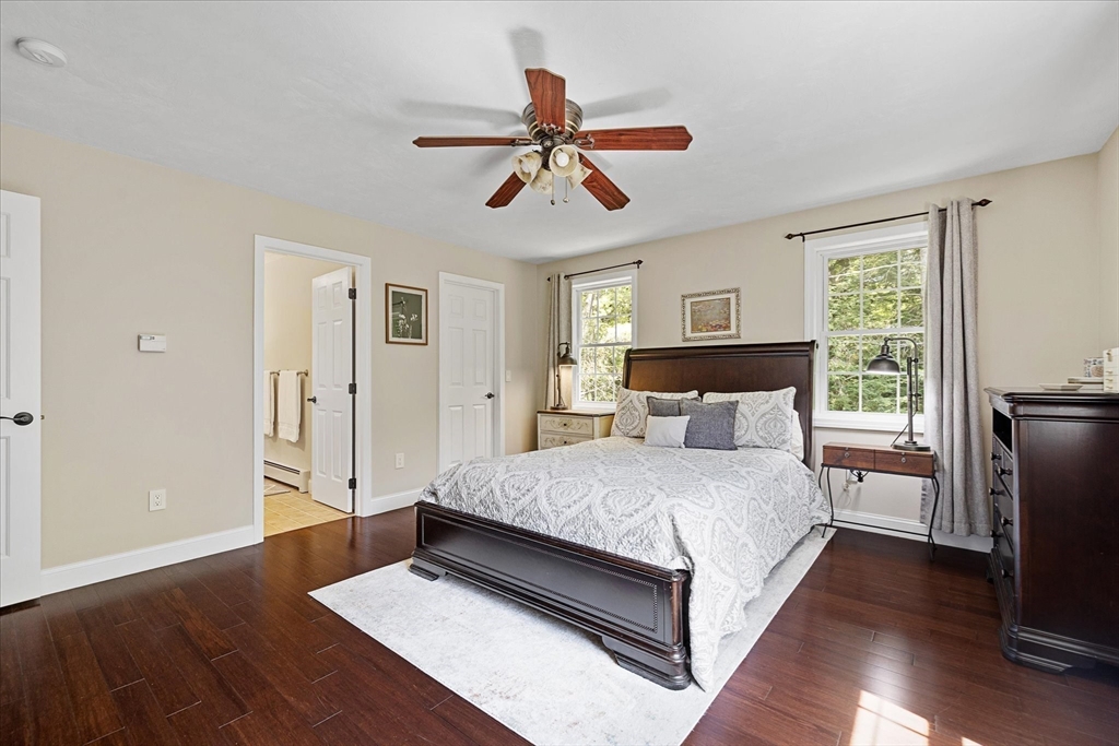 232 Sherbert Road Ashburnham, MA 01430 - Photo 18 of 42 a bedroom with a bed and wooden floor