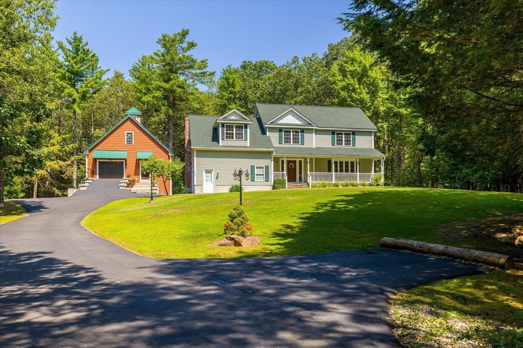 232 Sherbert Road Ashburnham, MA 01430 - Photo 2 of 42 a front view of a house with swimming pool