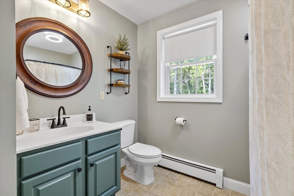 232 Sherbert Road Ashburnham, MA 01430 - Photo 26 of 42 a bathroom with a toilet a sink and a mirror