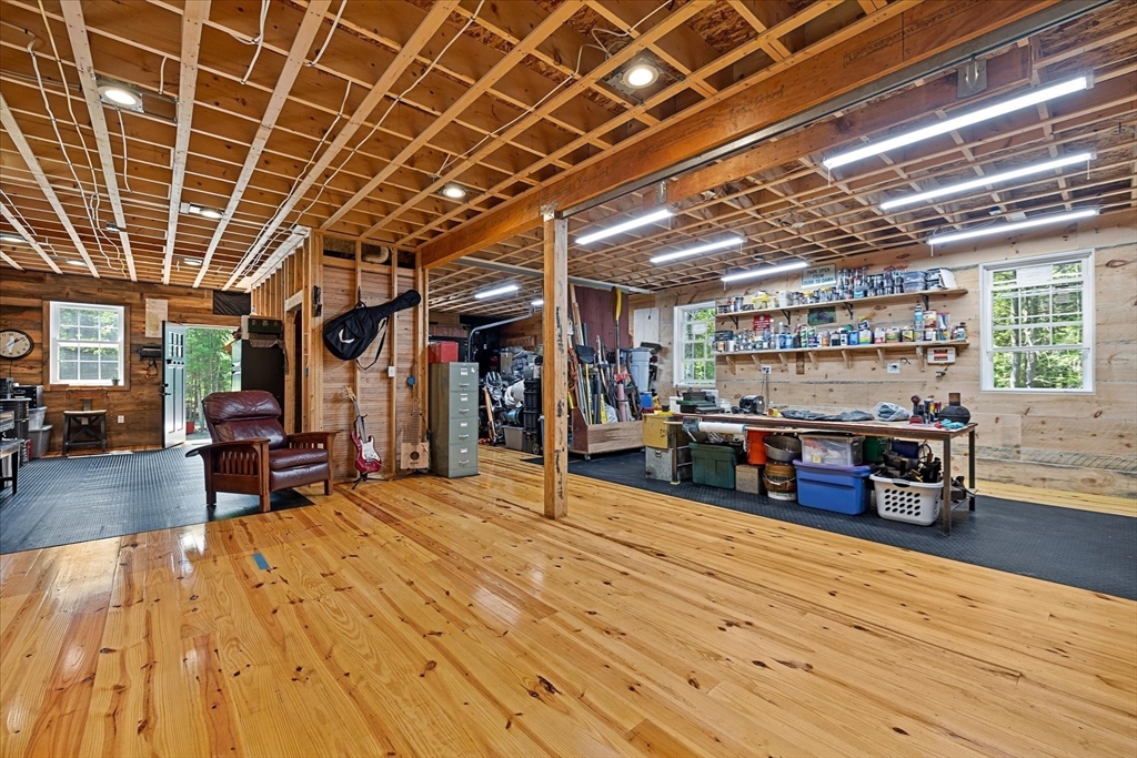232 Sherbert Road Ashburnham, MA 01430 - Photo 30 of 42 a room with lots of furniture and a wooden floor