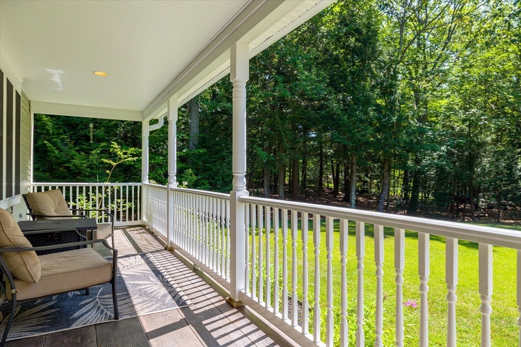 232 Sherbert Road Ashburnham, MA 01430 - Photo 6 of 42 a view of a wooden deck with a large window