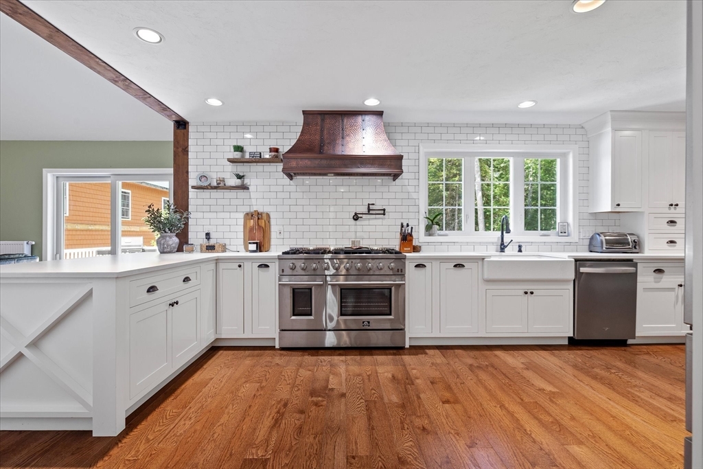 232 Sherbert Road Ashburnham, MA 01430 - Photo 8 of 42 a kitchen with a stove sink and a window