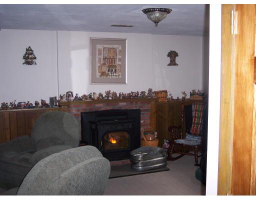 309 Mason Rd Extension Dudley, MA 01571 - Photo 6 of 13 a living room with furniture and a fireplace