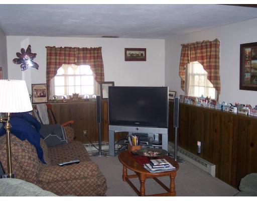 309 Mason Rd Extension Dudley, MA 01571 - Photo 8 of 13 a living room with furniture and a flat screen tv