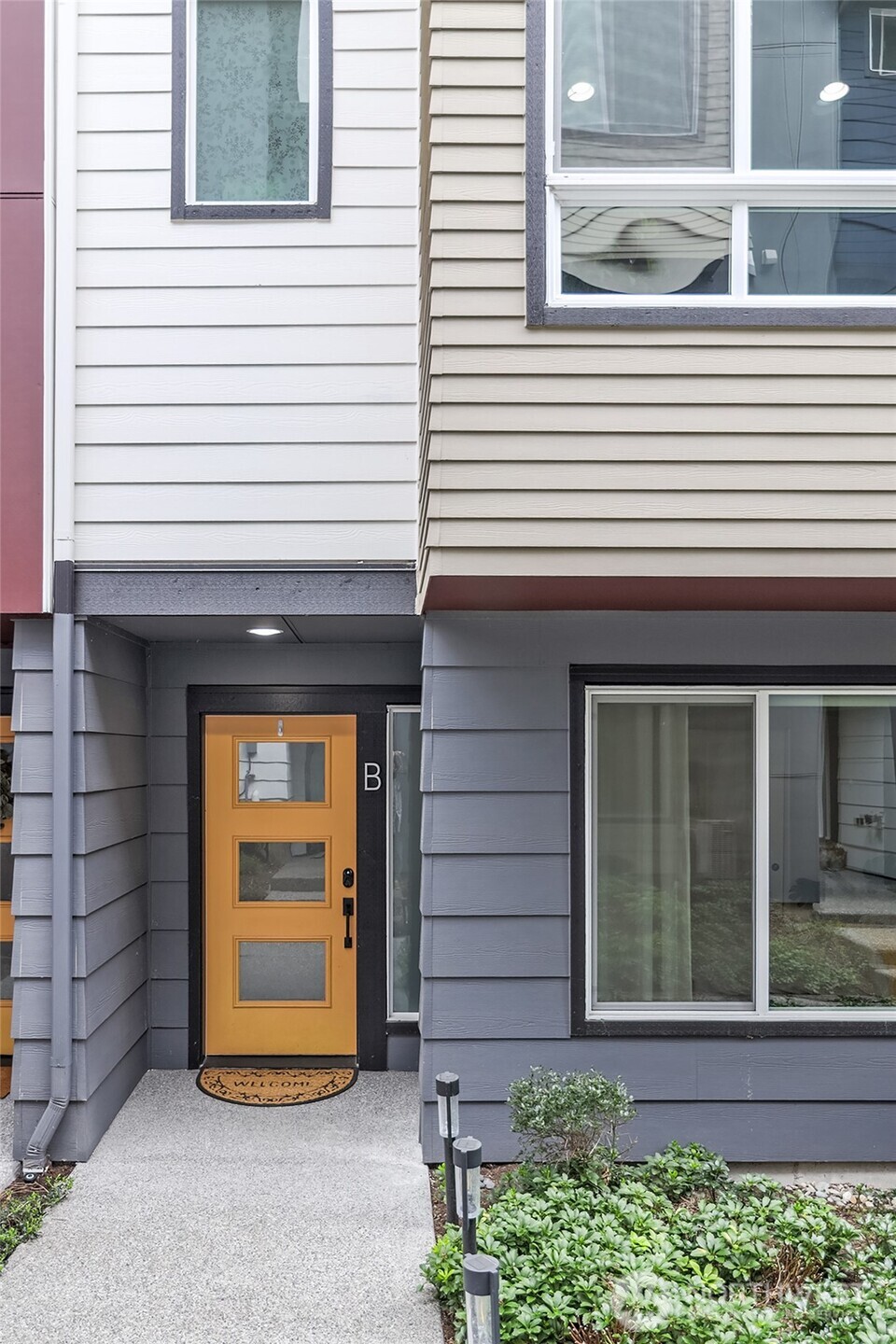 23630 6th Avenue Southeast, Unit B Bothell, WA 98021 - Photo 2 of 40 a front view of a house with a garage