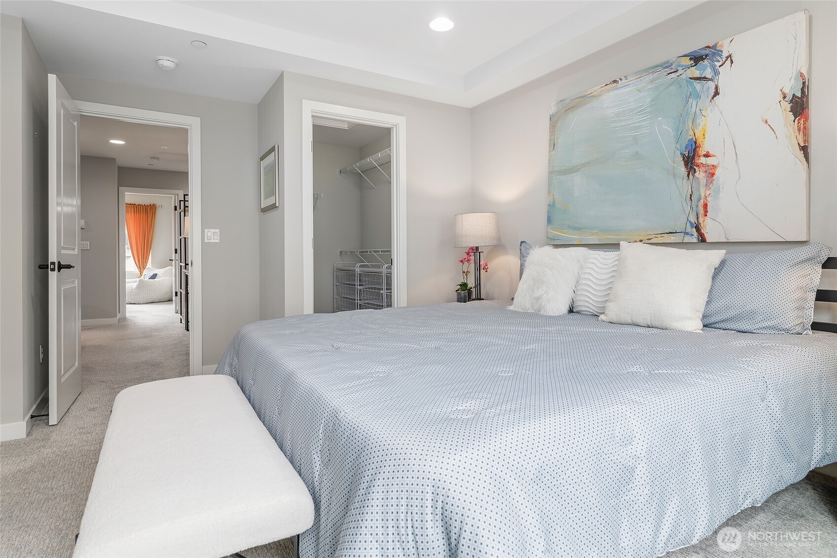 23630 6th Avenue Southeast, Unit B Bothell, WA 98021 - Photo 22 of 40 a bedroom with a bed and a painting on the wall