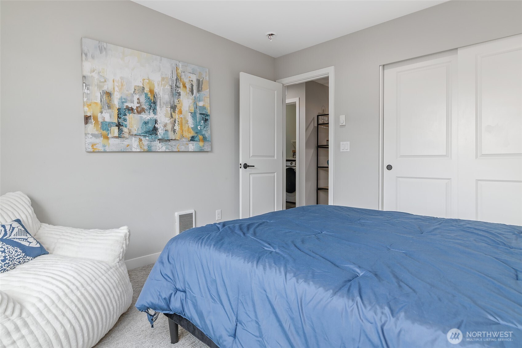 23630 6th Avenue Southeast, Unit B Bothell, WA 98021 - Photo 27 of 40 a bedroom with a bed and painting on the wall