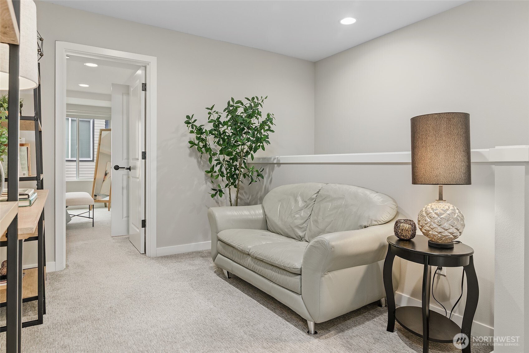 23630 6th Avenue Southeast, Unit B Bothell, WA 98021 - Photo 29 of 40 a living room with furniture and a potted plant
