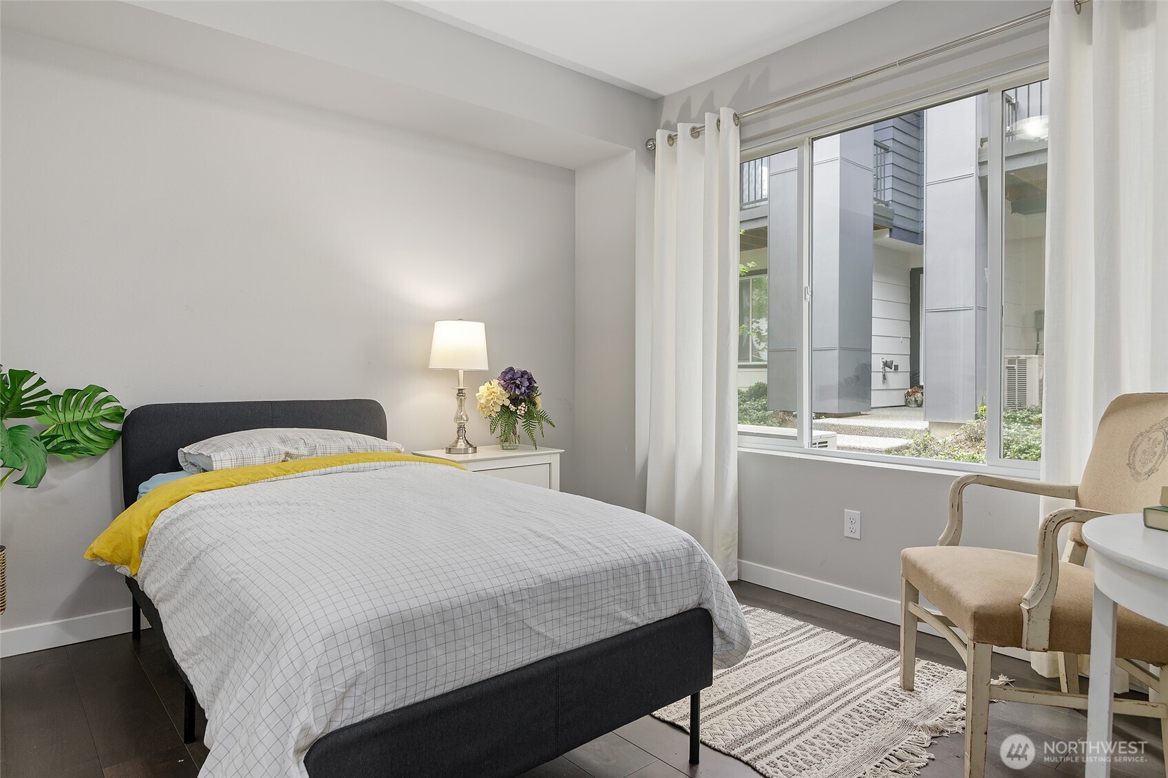 23630 6th Avenue Southeast, Unit B Bothell, WA 98021 - Photo 31 of 40 a bedroom with a bed and a table