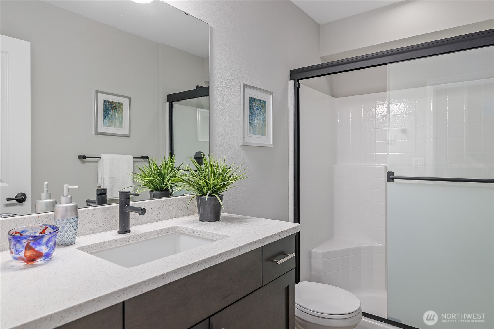 23630 6th Avenue Southeast, Unit B Bothell, WA 98021 - Photo 33 of 40 a bathroom with a sink a toilet a shower and a mirror