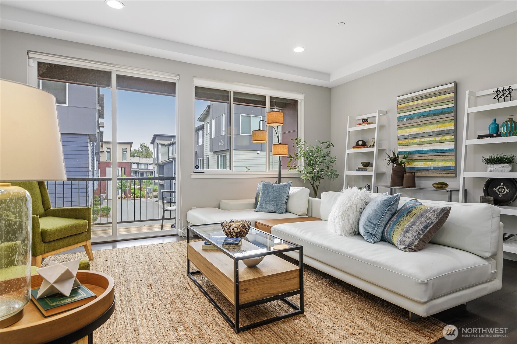23630 6th Avenue Southeast, Unit B Bothell, WA 98021 - Photo 7 of 40 a living room with furniture and a floor to ceiling window