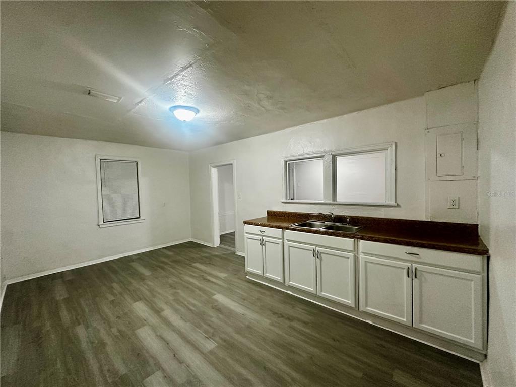 1907 Rio Grande Avenue Orlando, FL 32805 - Photo 9 of 17 a view of a kitchen with stainless steel appliances granite countertop a stove and a sink