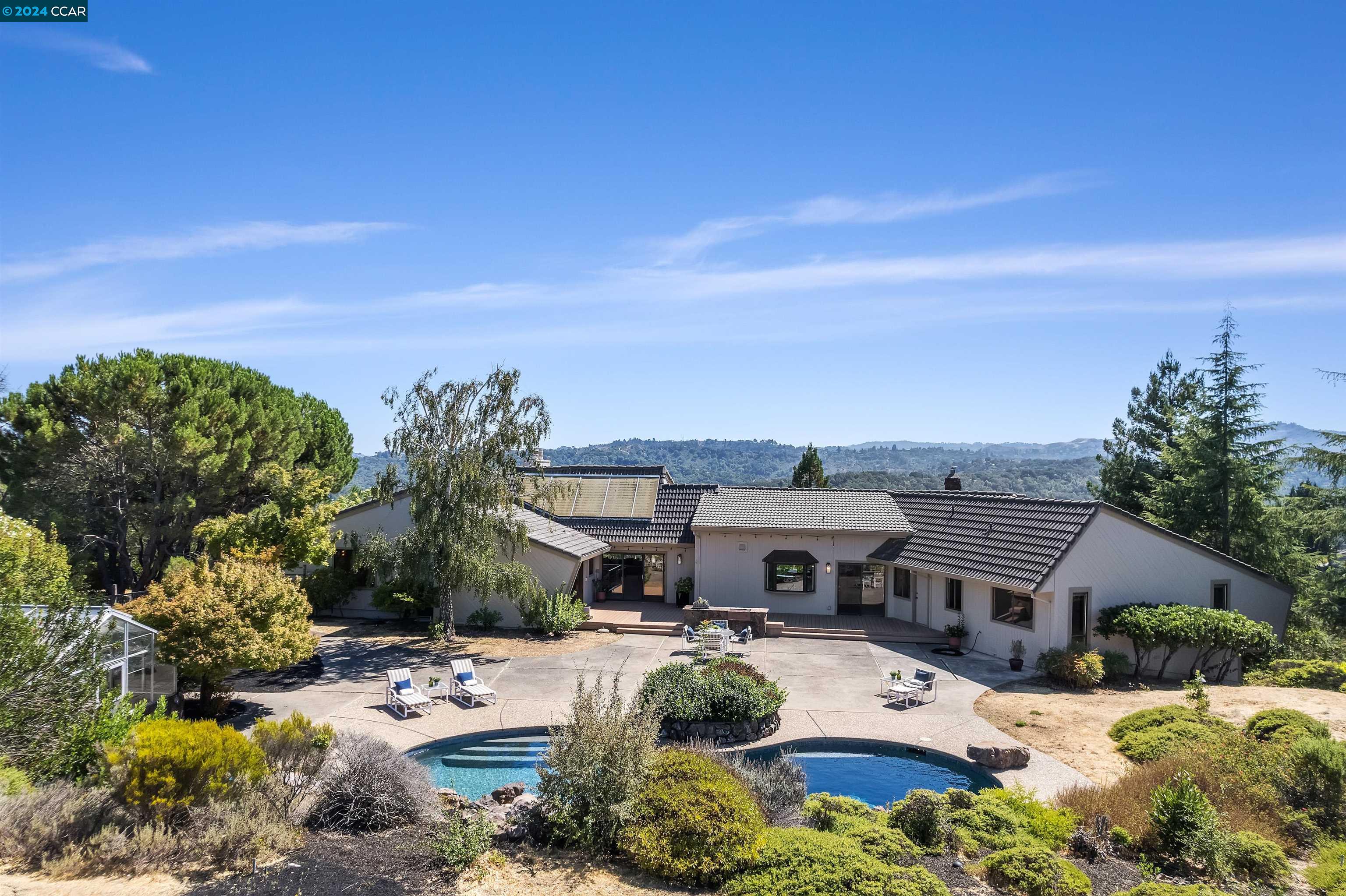 3930 Quail Ridge Road Lafayette, CA 94549 - Photo 1 of 1 a view of a house with a yard and sitting area