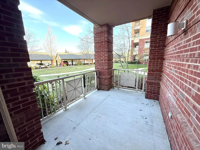 a view of a street with a house in the background