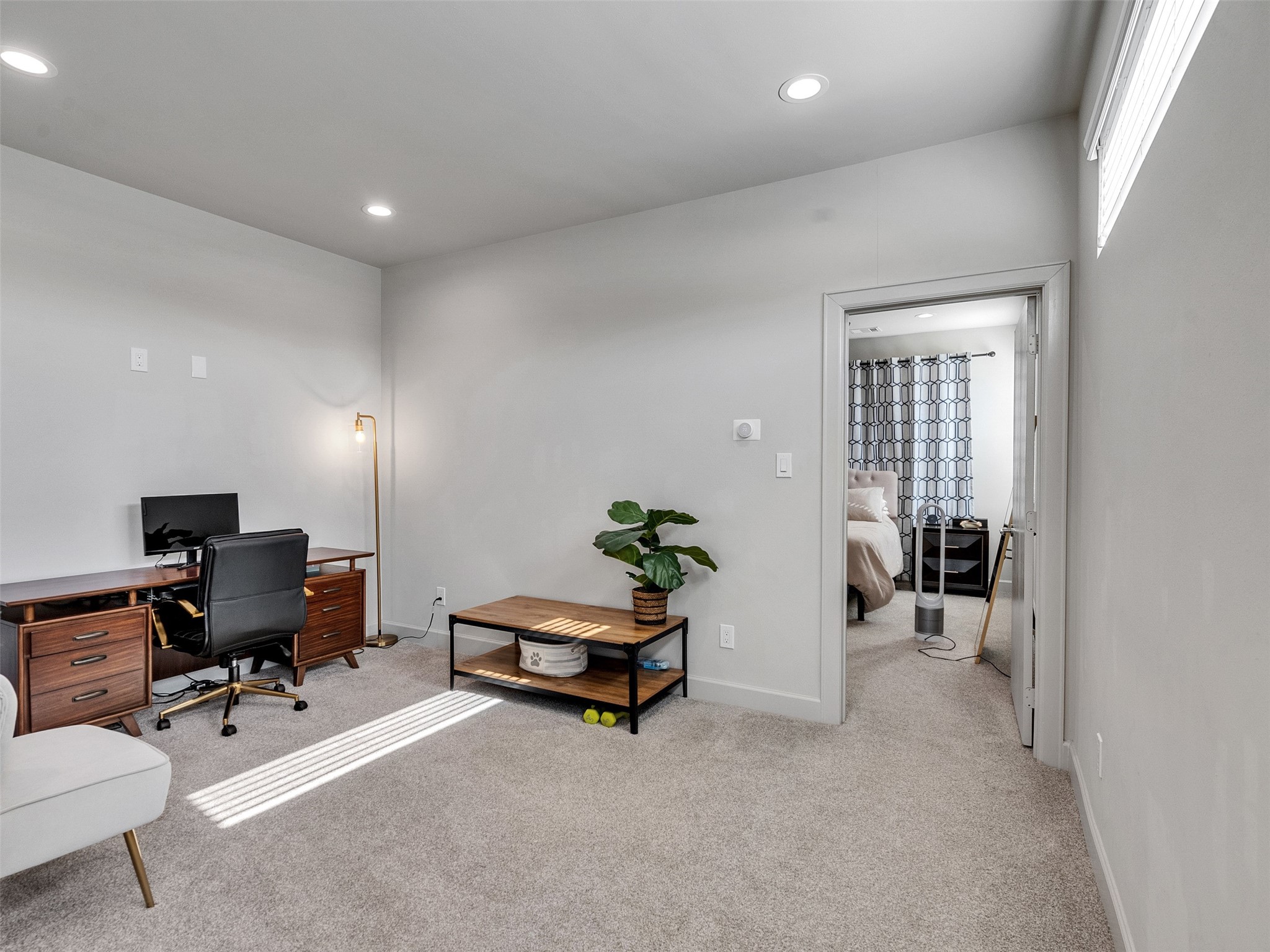 5702 Rucio Lane Houston, TX 77092 - Photo 19 of 30 a living room with furniture and a gym machine