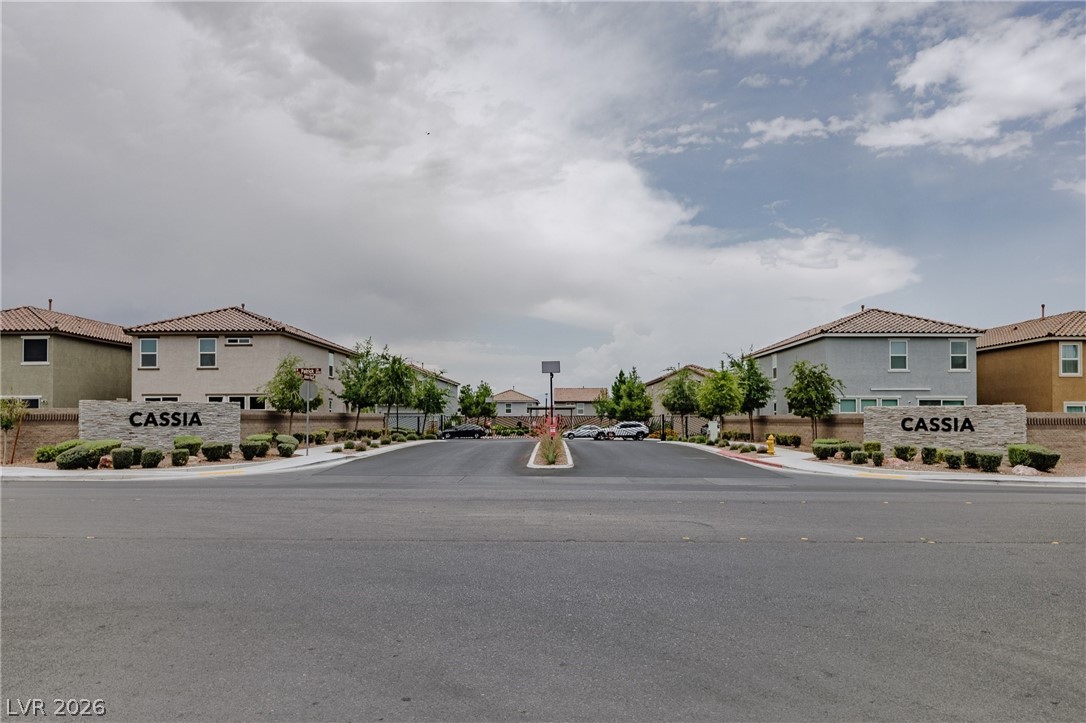 5927 Coja Street Las Vegas, NV 89113 - Photo 4 of 32 View of asphalt street with sidewalks, a residential view, and curbs