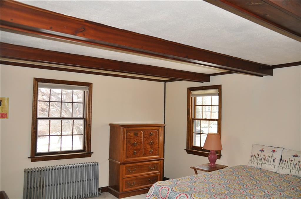 733 Greenlee Road Pittsburgh, PA 15227 - Photo 15 of 21 This large upstairs bedroom was the former Master bedroom and is generously sized. Hardwood floors are found underneath the carpeting.