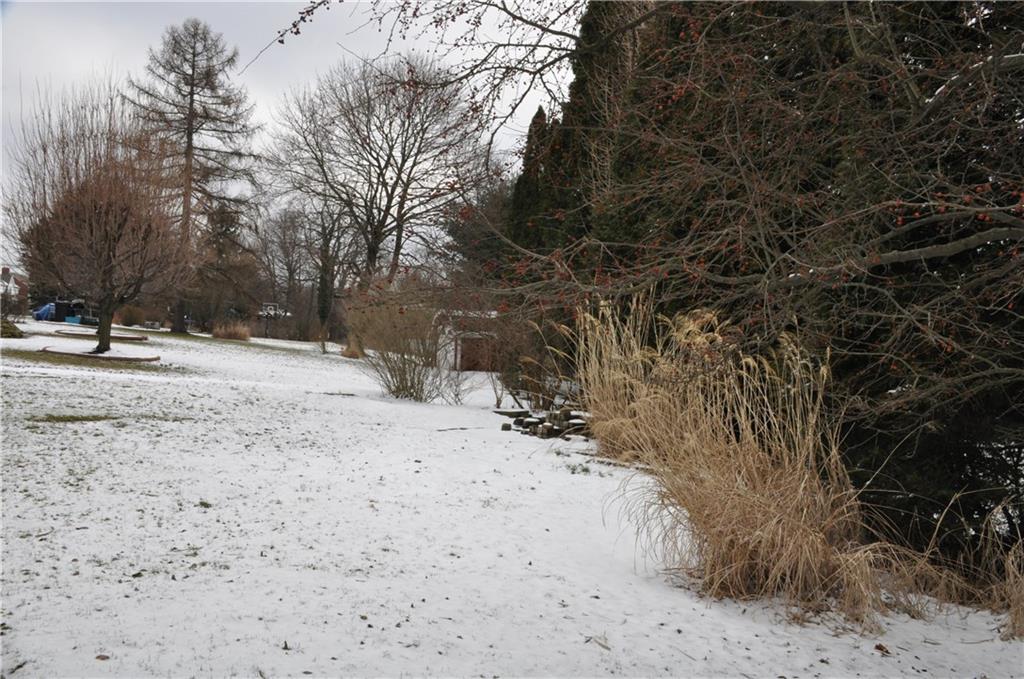 733 Greenlee Road Pittsburgh, PA 15227 - Photo 21 of 21 The backyard has mature landscaping and offers privacy.