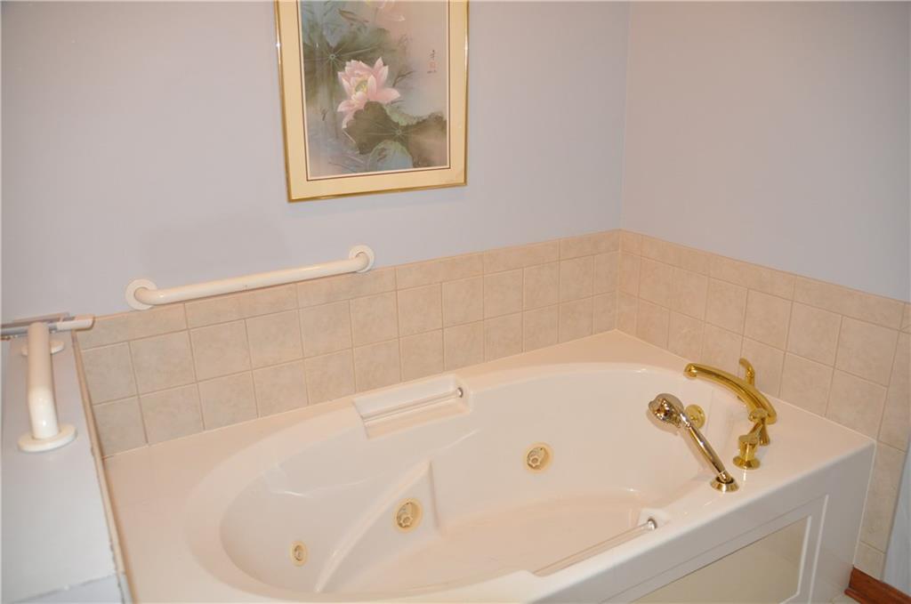 733 Greenlee Road Pittsburgh, PA 15227 - Photo 6 of 21 Soak your cares away in the jetted tub with grab bar and spray wand, or use the shower if you desire.