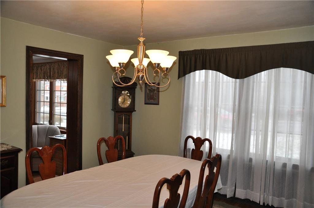 733 Greenlee Road Pittsburgh, PA 15227 - Photo 8 of 21 Large enough for hosting holiday meals, the dining room features hardwood floors, a new chandelier and a large picture window.