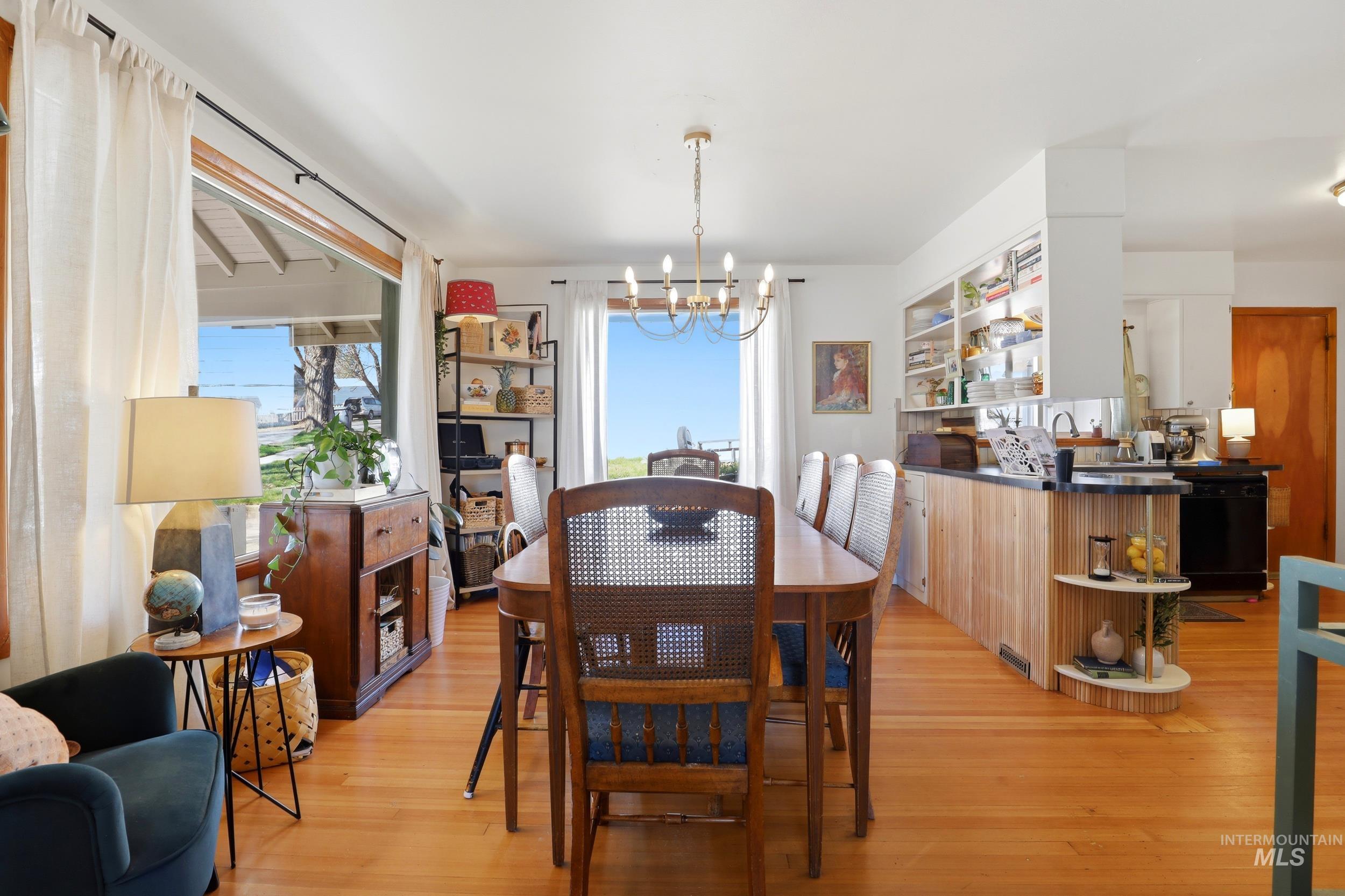 725 Elm Street Potlatch, ID 83855 - Photo 11 of 50 Dining room with hanging lights, healthy amount of natural light, and light wood-style floors