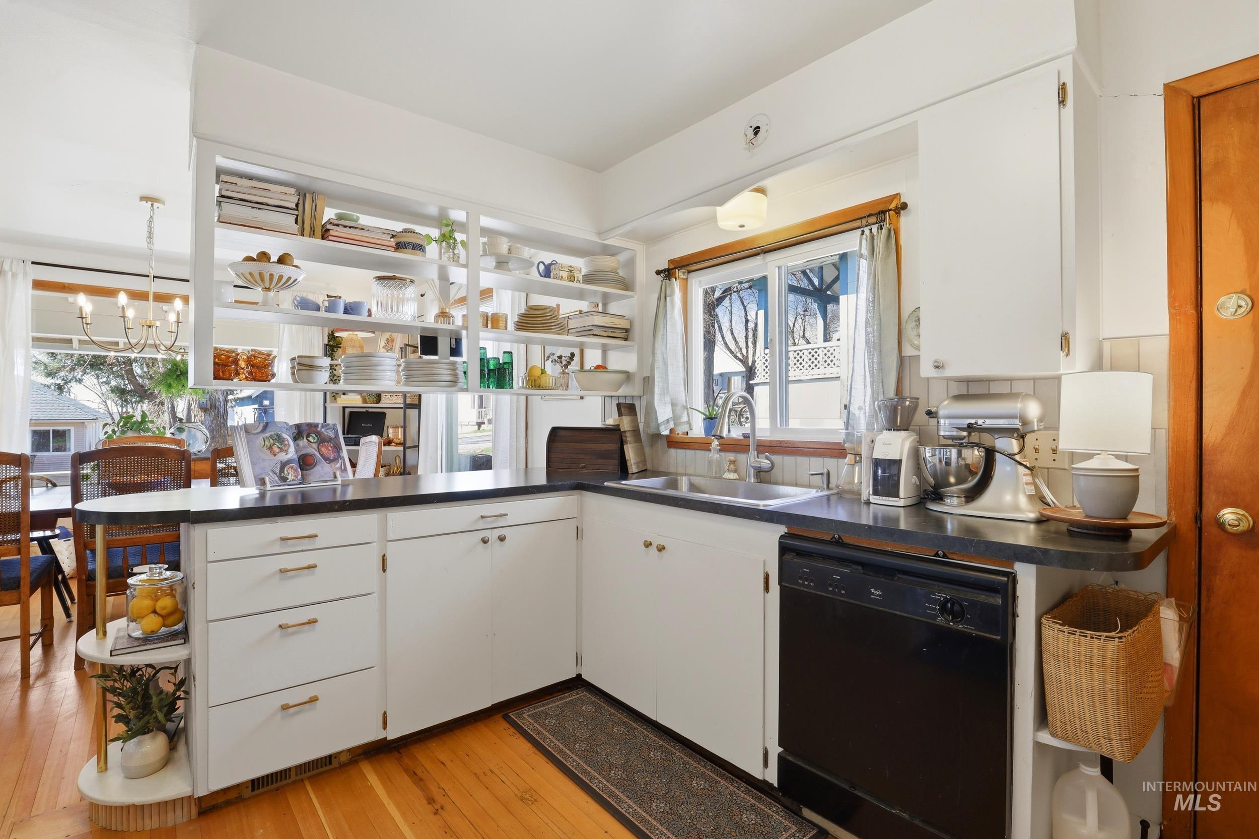 725 Elm Street Potlatch, ID 83855 - Photo 20 of 50 Kitchen featuring white cabinetry, open shelves, dishwasher, and dark countertops