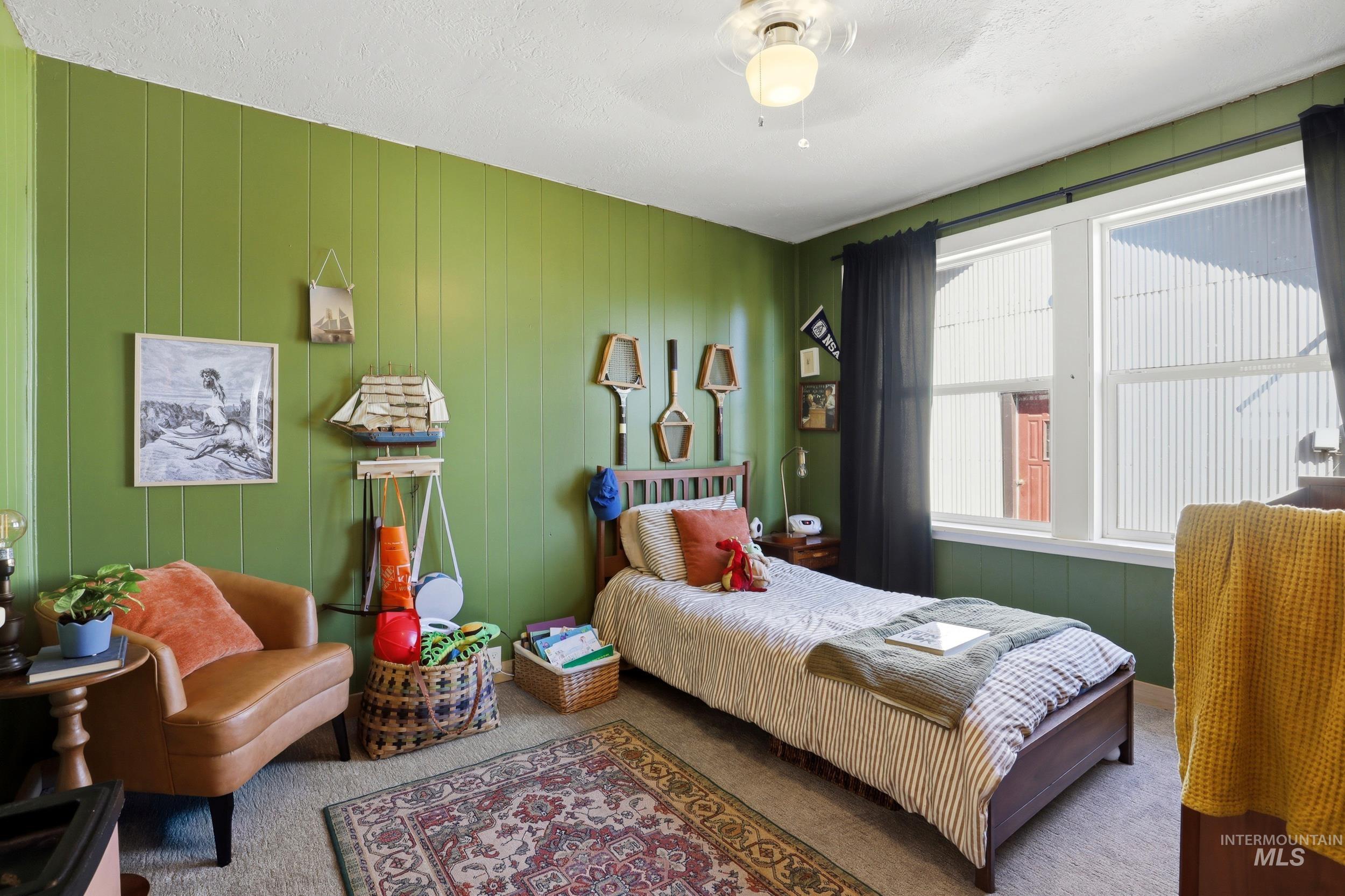 725 Elm Street Potlatch, ID 83855 - Photo 24 of 50 Carpeted bedroom with a ceiling fan and a textured ceiling