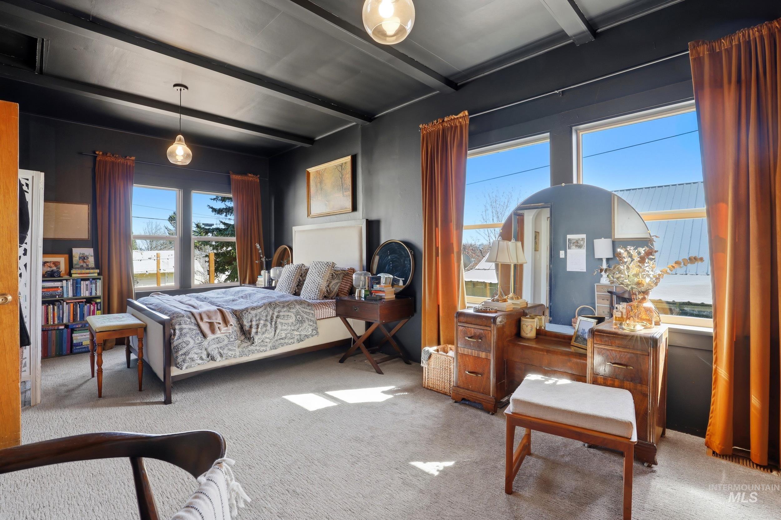 725 Elm Street Potlatch, ID 83855 - Photo 26 of 50 Bedroom featuring light colored carpet and beamed ceiling