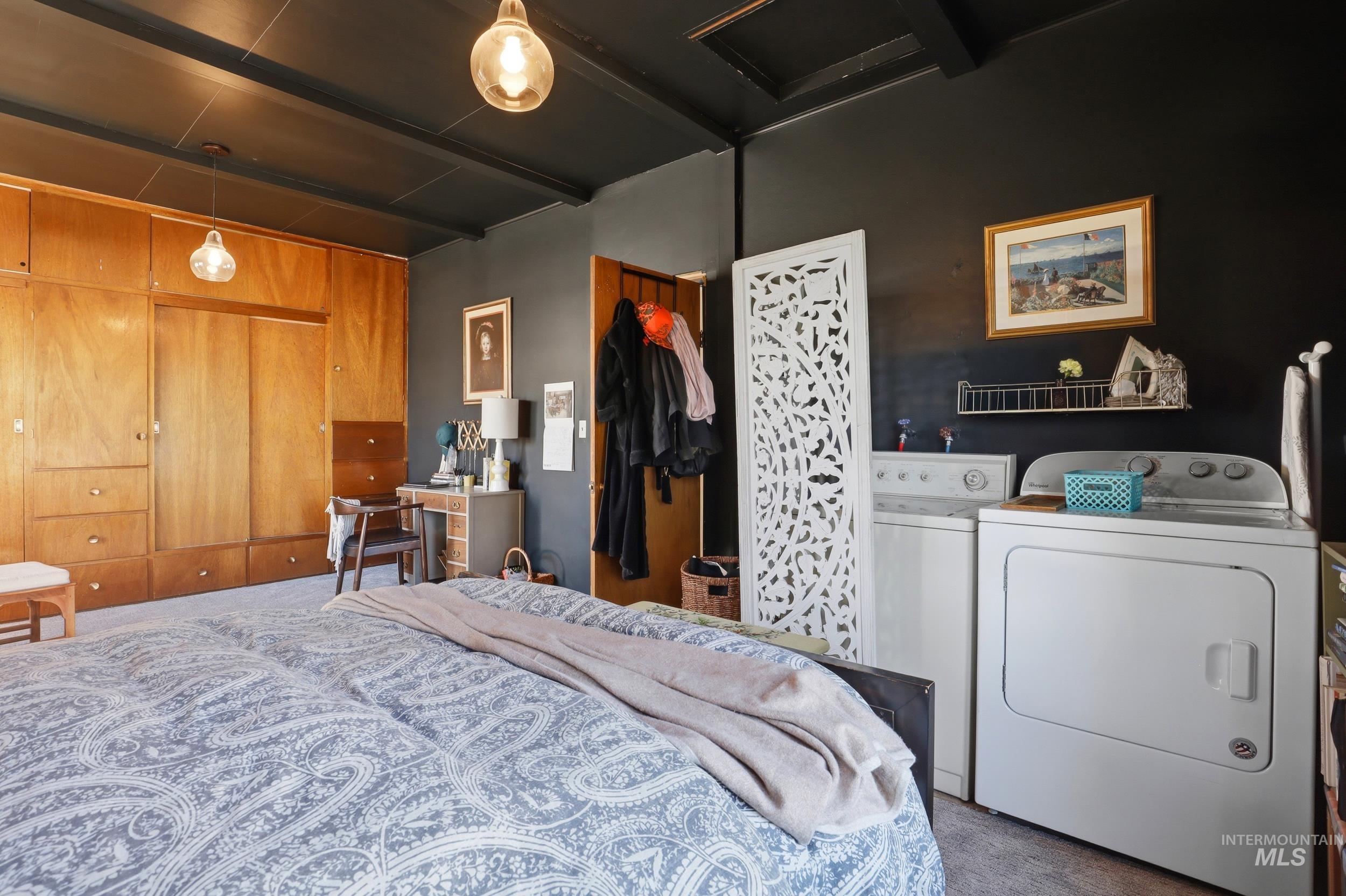 725 Elm Street Potlatch, ID 83855 - Photo 27 of 50 Carpeted bedroom with a closet, washing machine and dryer, and beam ceiling