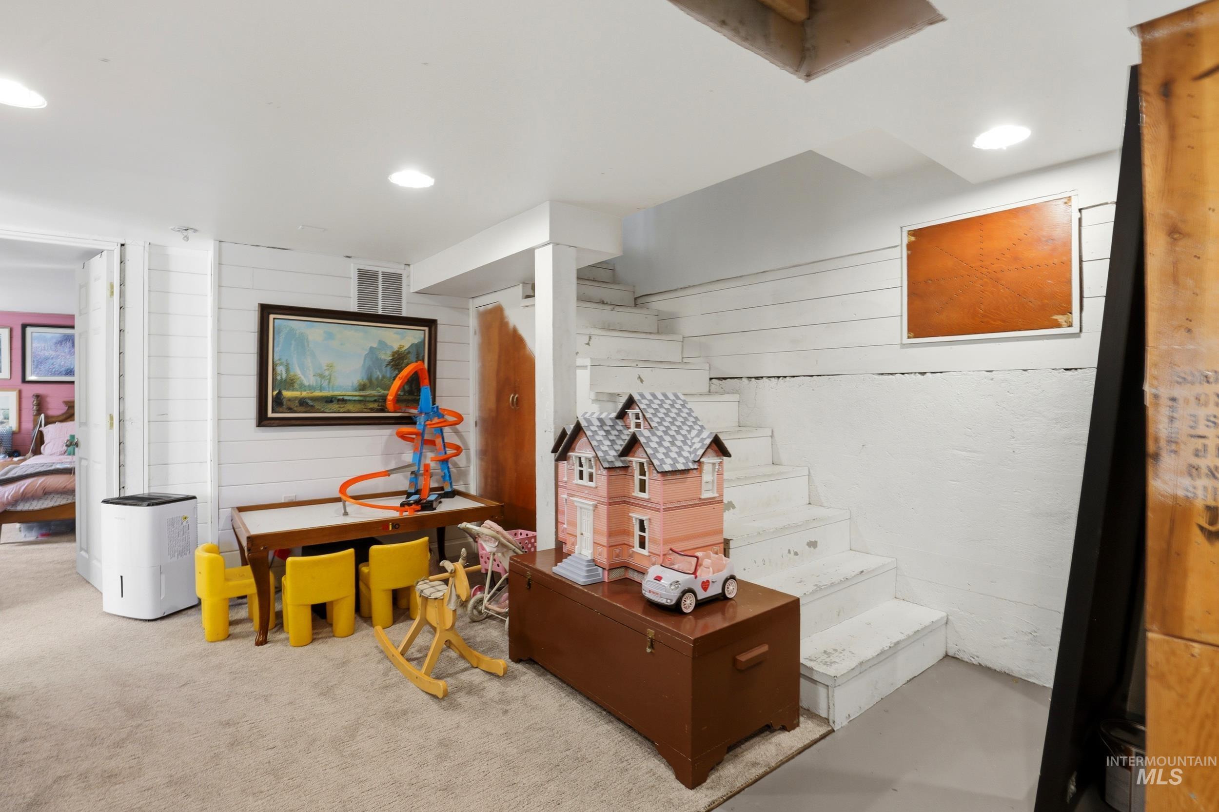 725 Elm Street Potlatch, ID 83855 - Photo 32 of 50 Finished below grade area with wooden walls and recessed lighting