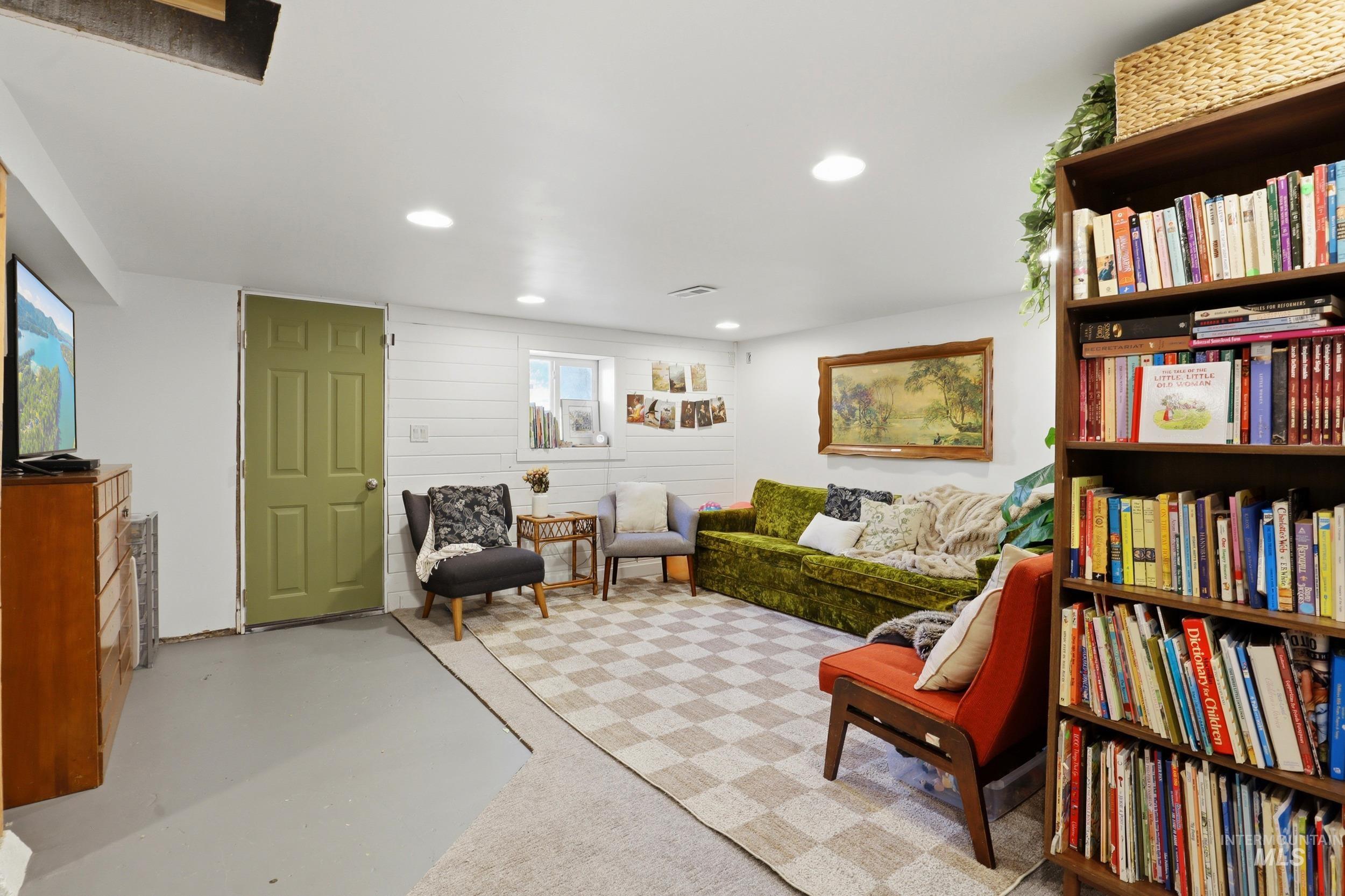 725 Elm Street Potlatch, ID 83855 - Photo 34 of 50 Sitting room featuring finished concrete flooring, recessed lighting, and wooden walls