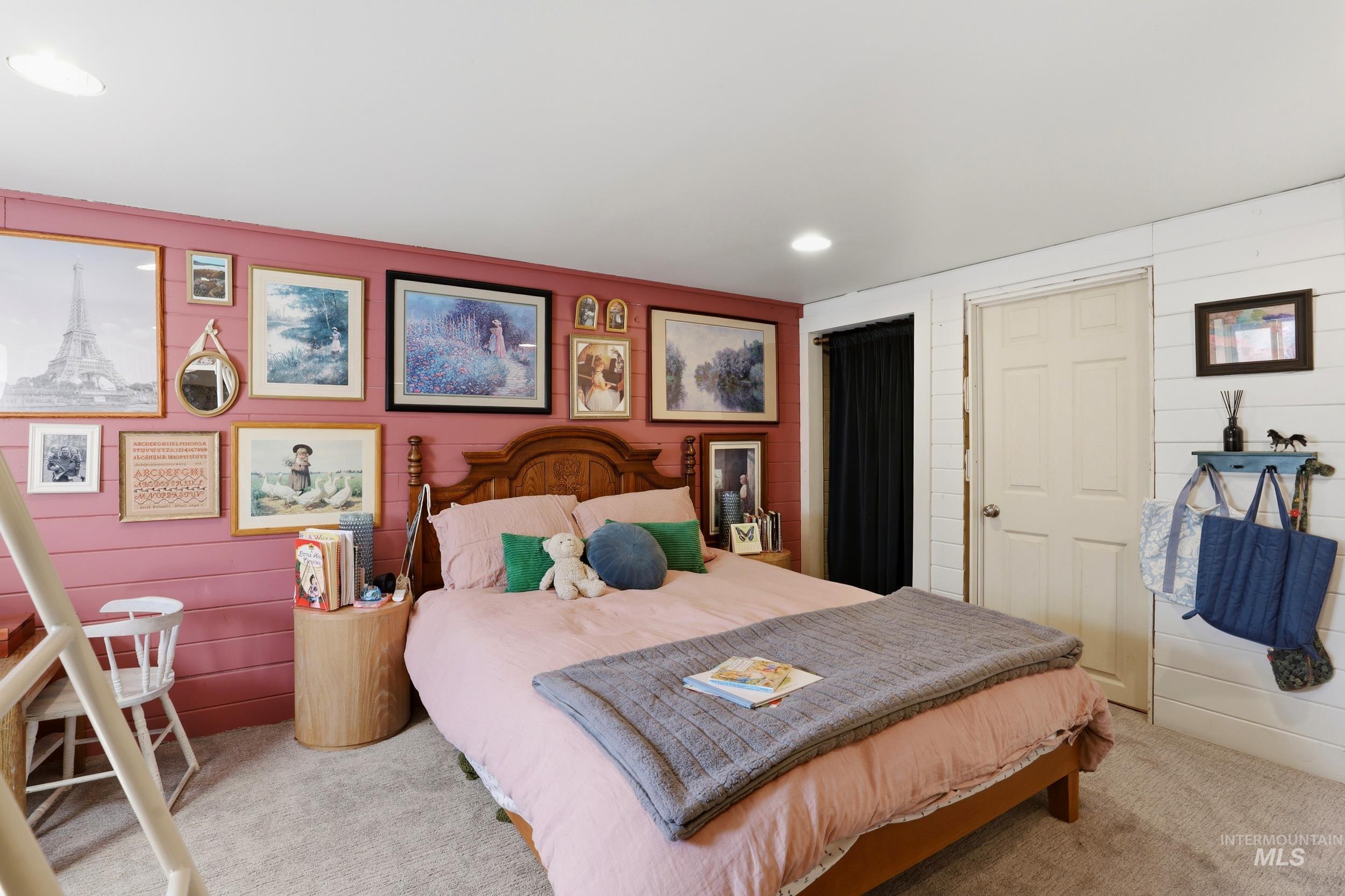 725 Elm Street Potlatch, ID 83855 - Photo 36 of 50 Bedroom featuring carpet floors, a closet, recessed lighting, and wood walls