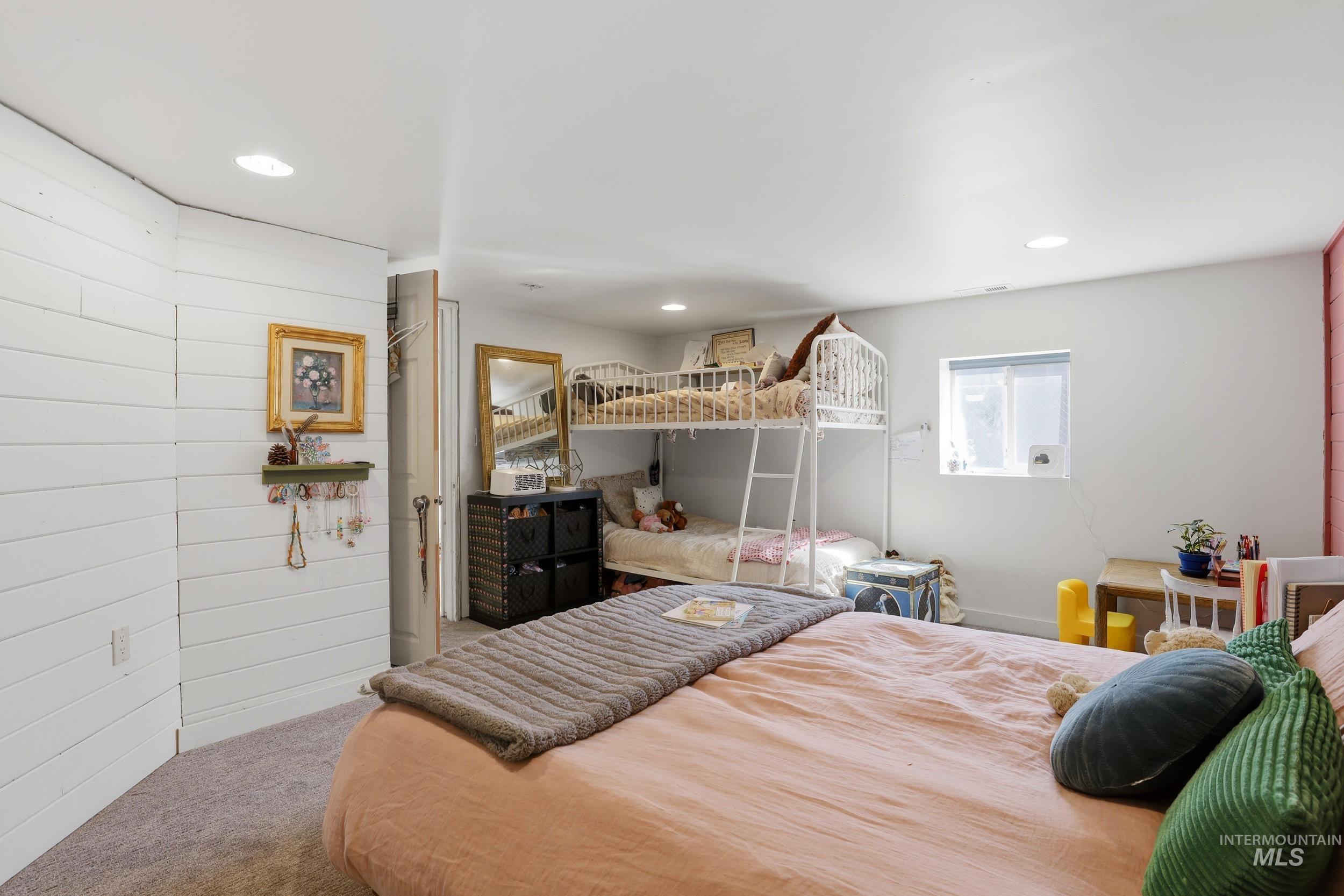 725 Elm Street Potlatch, ID 83855 - Photo 38 of 50 Carpeted bedroom featuring recessed lighting and wooden walls