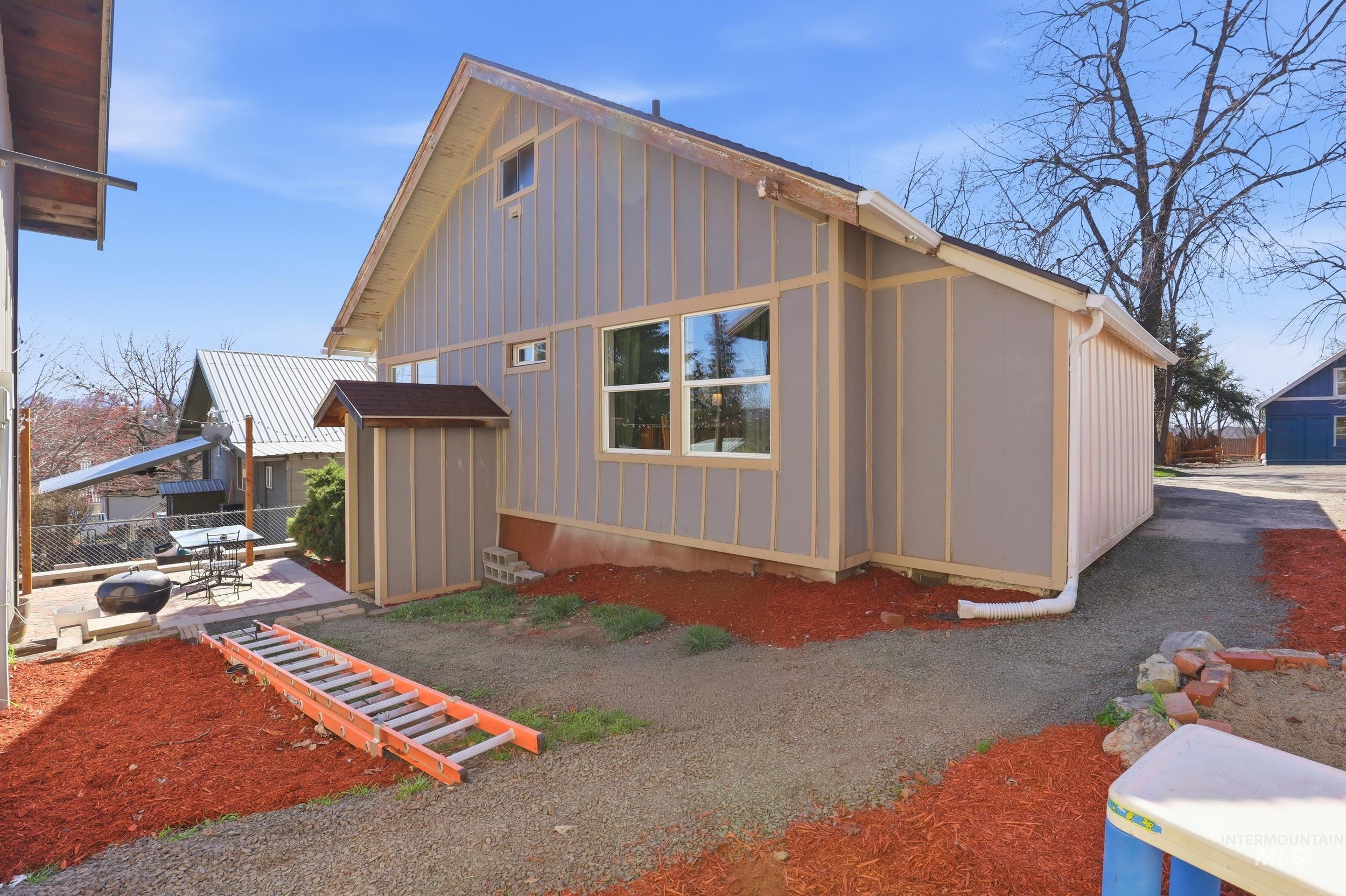 725 Elm Street Potlatch, ID 83855 - Photo 40 of 50 View of property exterior featuring board and batten siding and a patio area