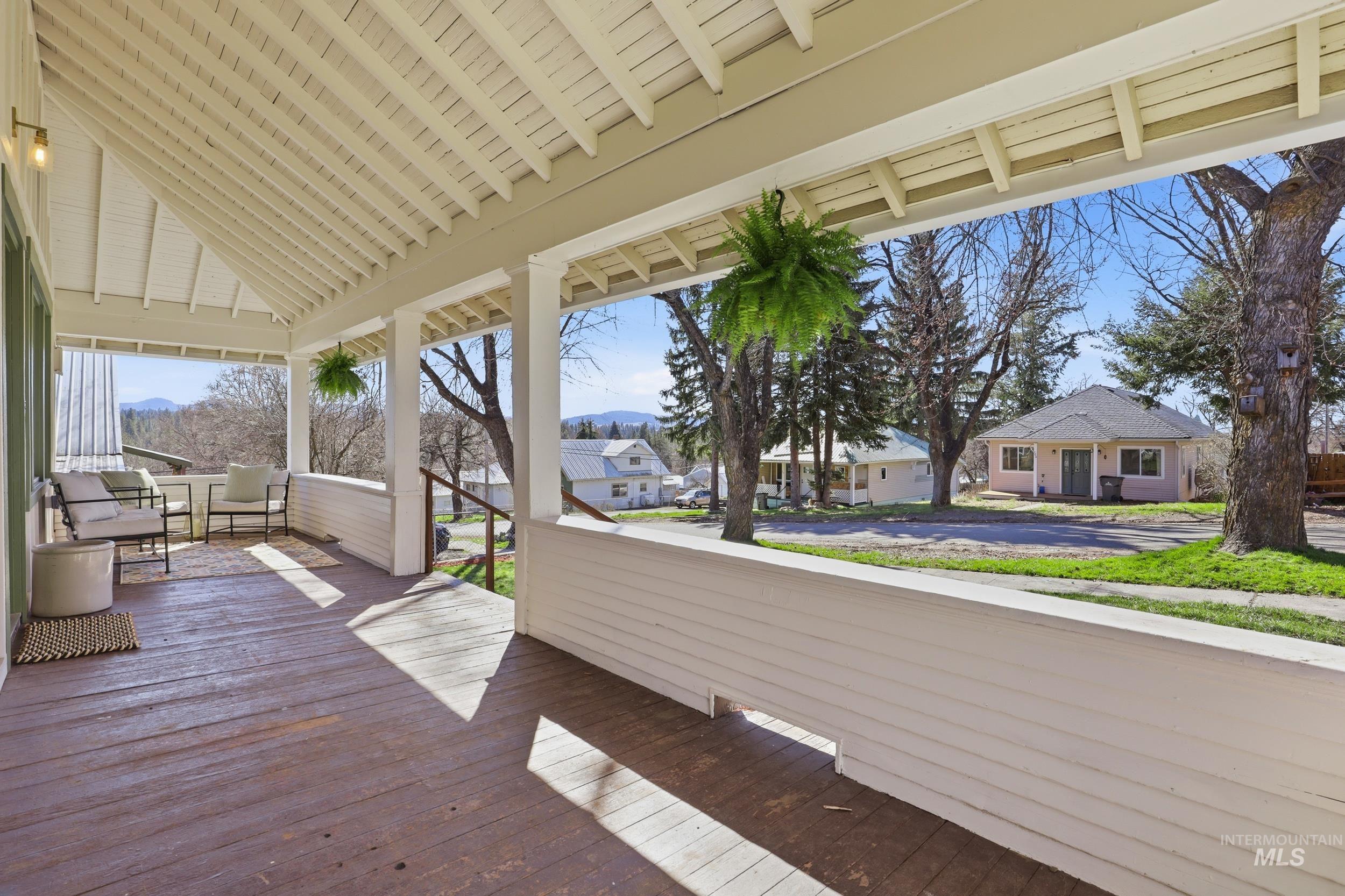 725 Elm Street Potlatch, ID 83855 - Photo 5 of 50 Deck featuring a mountain view and a residential view